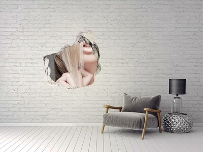 Vinilo decorativo boquete pared irregular Una mirada encantadora desde detrás de la pared.