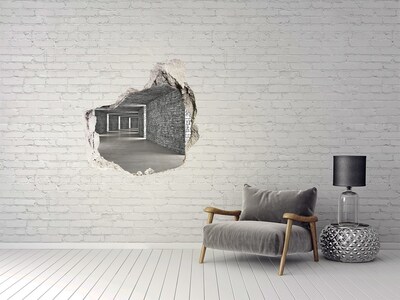 Vinilo decorativo boquete pared irregular Una pared en ruinas con vistas a un espacio vacío