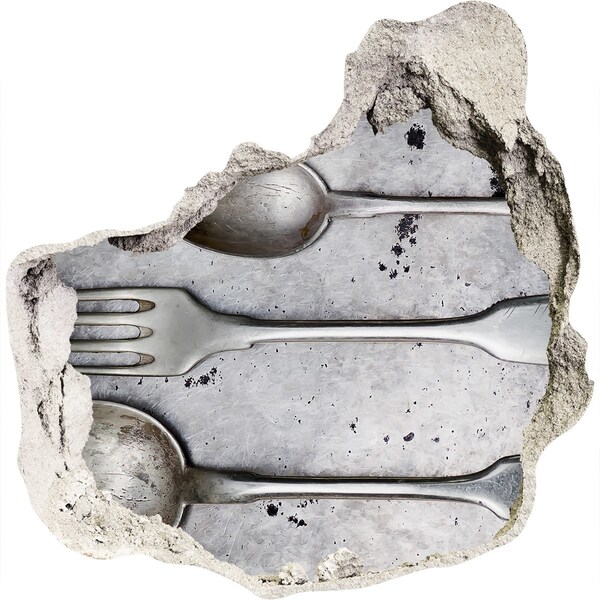 Fototapeta dziura na ścianę Złamana ściana z widokiem na sztućce