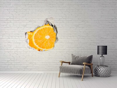 Vinilo decorativo boquete pared irregular Naranja jugosa en un agujero en la pared