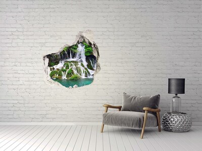 Vinilo adhesivo efecto agujero 3d para casa Una cascada en un entorno verde.