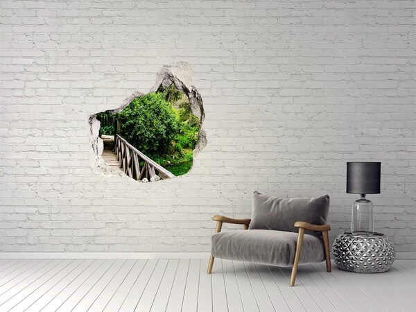 Vinilo adhesivo efecto agujero 3d para casa Un paraíso verde con un puente de madera.