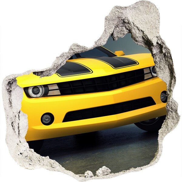 Vinilo decorativo boquete pared irregular Una pared en ruinas con un coche amarillo.