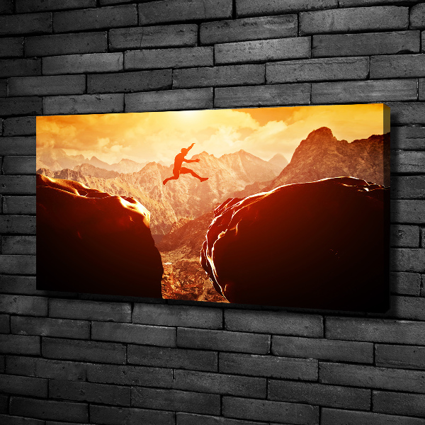 Cuadro canvas con impresión uv duradera horizontal Saltar sobre el abismo