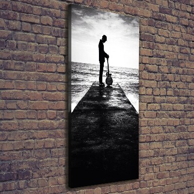 Cuadro canvas decorativo para salón vertical Guitarrista en el muelle