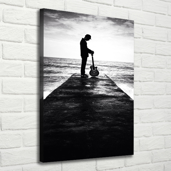 Cuadro canvas decorativo para salón vertical Guitarrista en el muelle