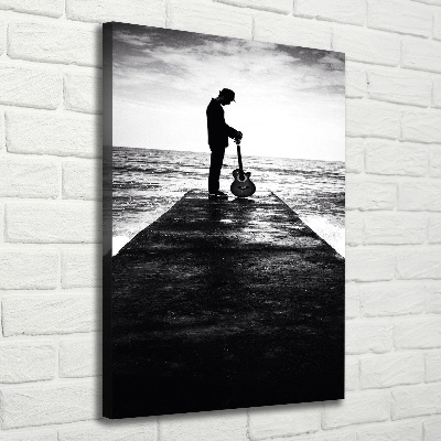 Cuadro canvas decorativo para salón vertical Guitarrista en el muelle