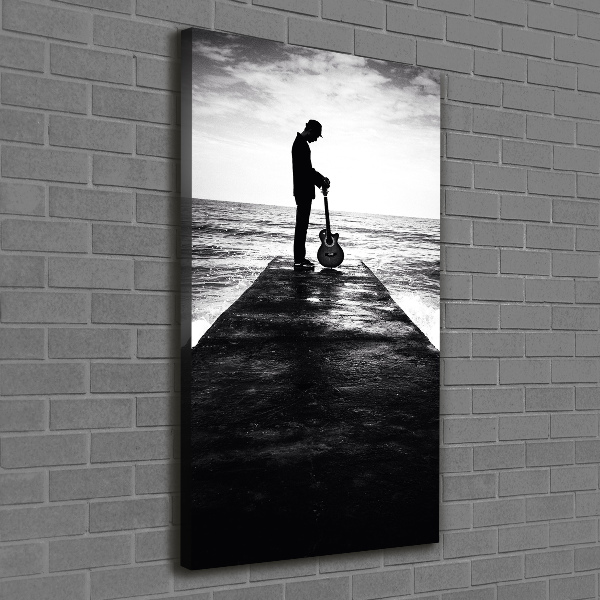 Cuadro canvas decorativo para salón vertical Guitarrista en el muelle