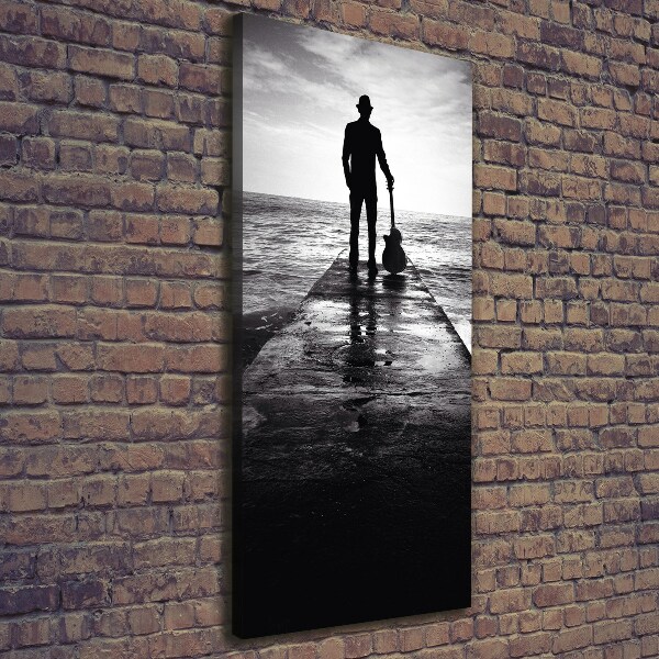 Cuadro moderno en lienzo resistente uv vertical Guitarrista en el muelle