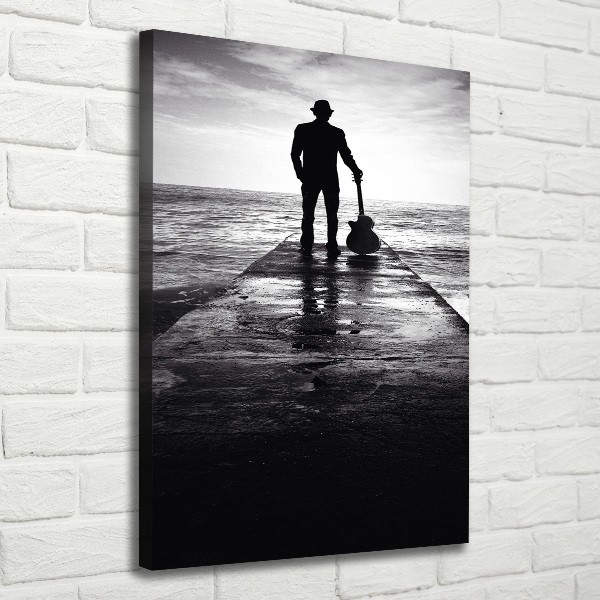 Cuadro moderno en lienzo resistente uv vertical Guitarrista en el muelle