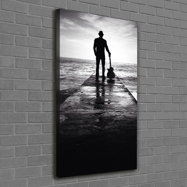 Cuadro moderno en lienzo resistente uv vertical Guitarrista en el muelle