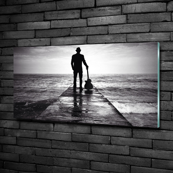 Cuadro decorativo de vidrio para salón horizontal Guitarrista en el muelle