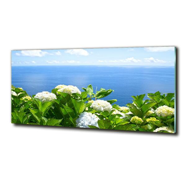 Cuadro decorativo de vidrio para salón horizontal Flores junto al mar