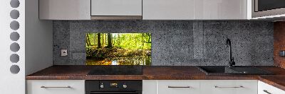 Panel antisalpicaduras rayos de sol en el bosque