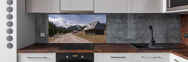 Panel de pared de cocina Una cabaña en las montañas