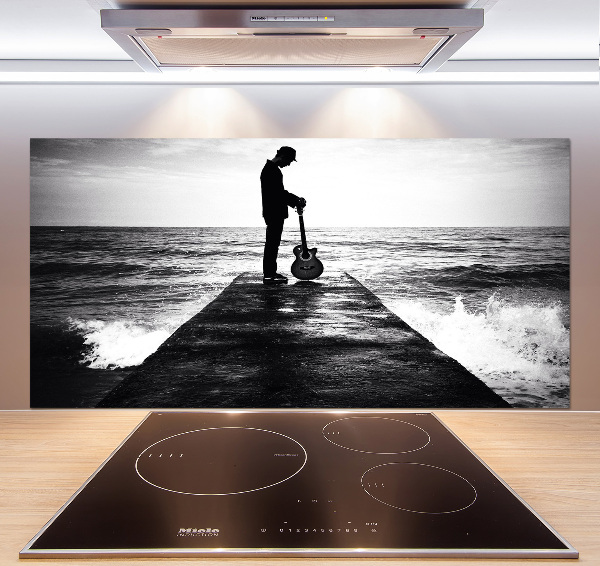 Salpicadero de cocina Guitarrista en el muelle