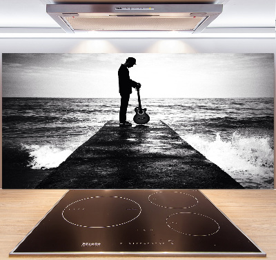 Salpicadero de cocina Guitarrista en el muelle