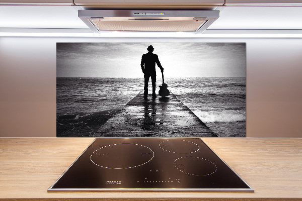 Panel antisalpicaduras Guitarrista en el muelle