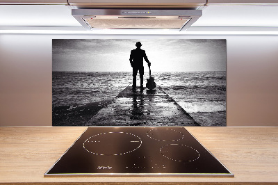 Panel antisalpicaduras Guitarrista en el muelle