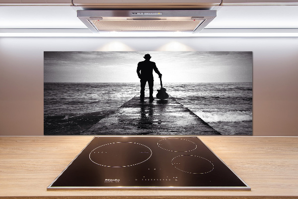 Panel antisalpicaduras Guitarrista en el muelle