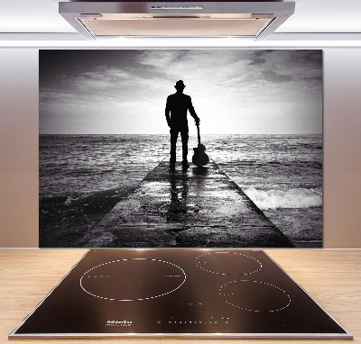 Panel antisalpicaduras Guitarrista en el muelle