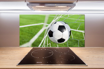 Panel antisalpicaduras El balón está en la portería.