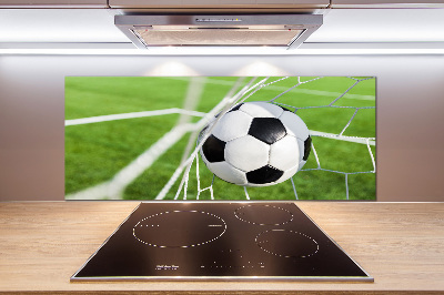 Panel antisalpicaduras El balón está en la portería.