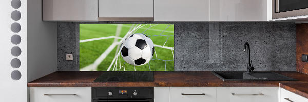 Panel antisalpicaduras El balón está en la portería.