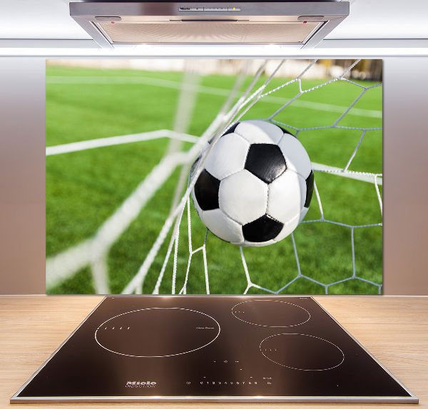 Panel antisalpicaduras El balón está en la portería.