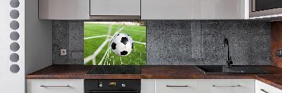 Panel antisalpicaduras El balón está en la portería.