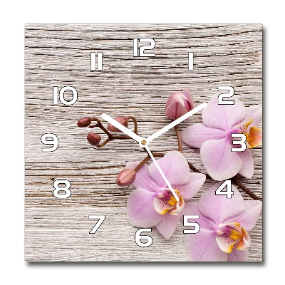 Reloj cuadrado Orquídea sobre madera