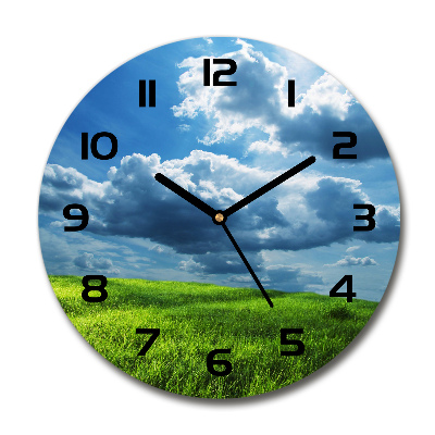 Reloj de cristal redondo Nubes sobre el campo