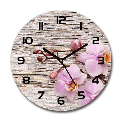 Reloj de cristal redondo Orquídea sobre madera
