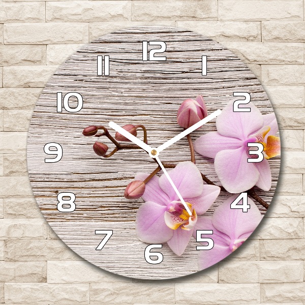 Reloj de cristal redondo Orquídea sobre madera