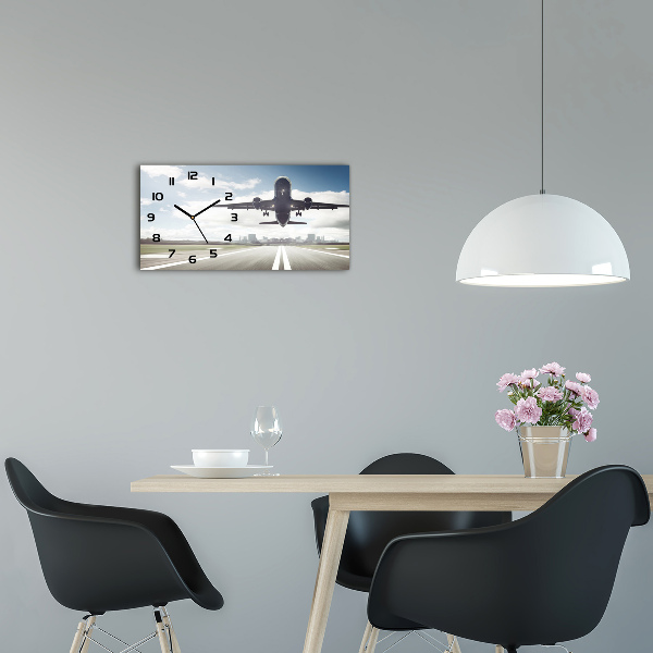 Reloj horizontal Un avión despegando