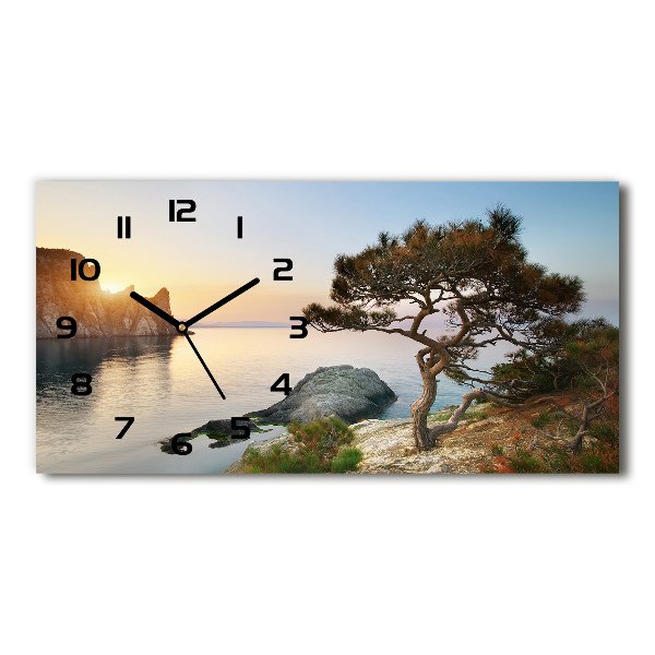 Reloj horizontal Un árbol junto al mar