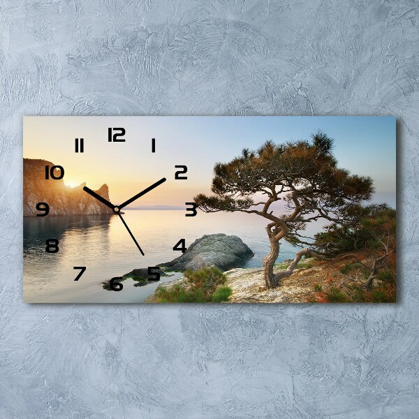 Reloj horizontal Un árbol junto al mar