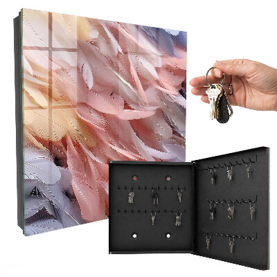 Caja para llaves en tonos pastel con diseño de plumas
