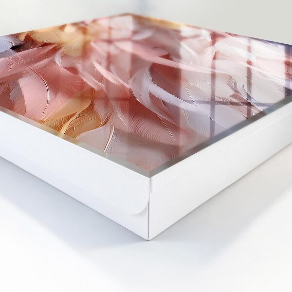 Caja para llaves en tonos pastel con diseño de plumas