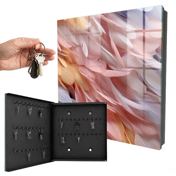 Caja para llaves en tonos pastel con diseño de plumas