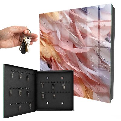 Caja para llaves en tonos pastel con diseño de plumas