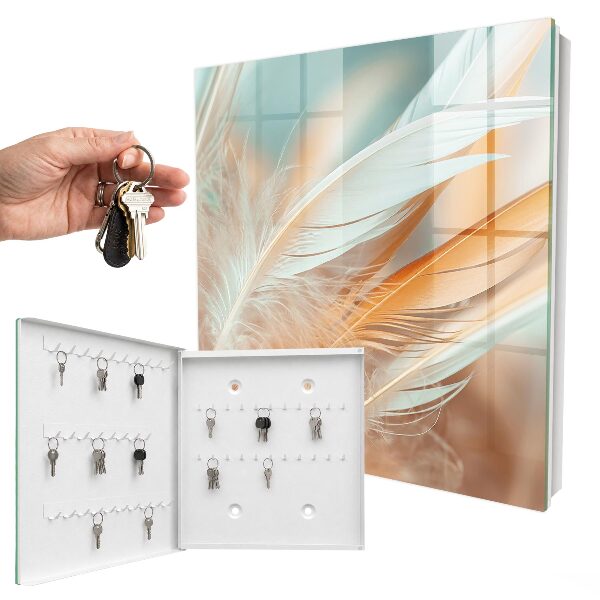 Armario para llaves con diseño de plumas en tonos pastel