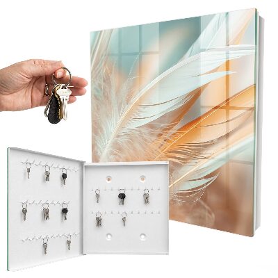 Armario para llaves con diseño de plumas en tonos pastel