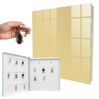 Armario para llaves de color beige amarillento