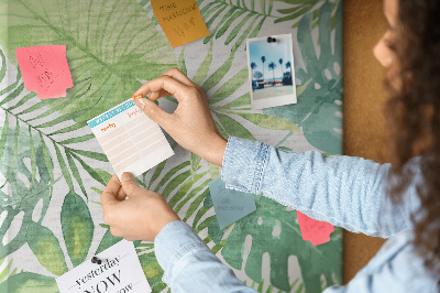 Tablero de corcho para pared Estampado de hojas tropicales en tonos verdes.