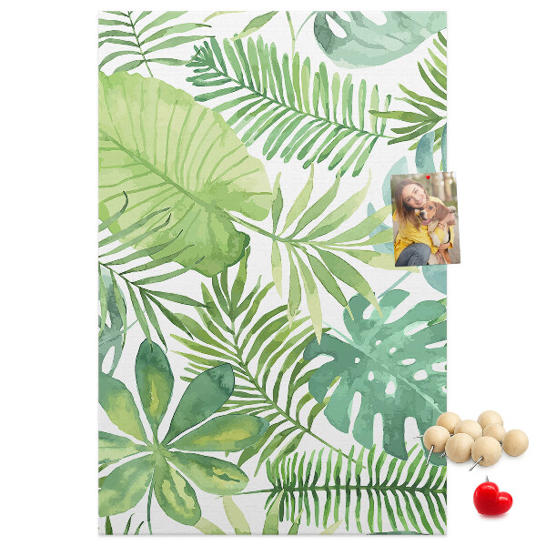 Tablero de corcho para pared Estampado de hojas tropicales en tonos verdes.