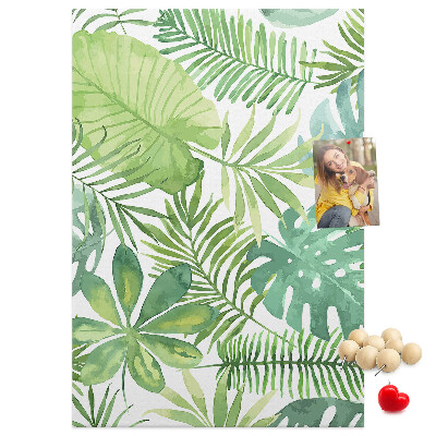 Tablero de corcho para pared Estampado de hojas tropicales en tonos verdes.