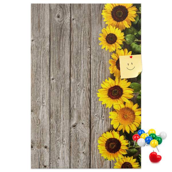 Decoración pizarra de corcho Girasoles sobre un fondo de tabla de madera
