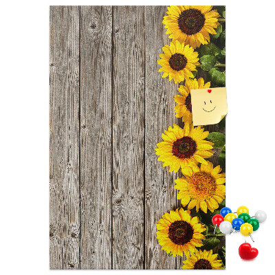 Decoración pizarra de corcho Girasoles sobre un fondo de tabla de madera