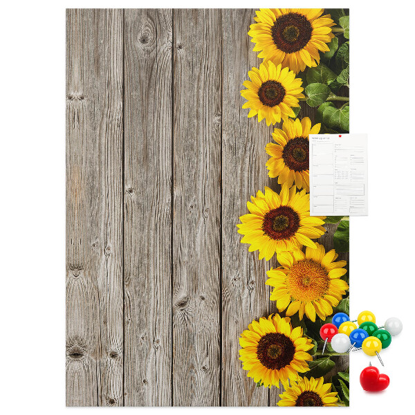 Decoración pizarra de corcho Girasoles sobre un fondo de tabla de madera